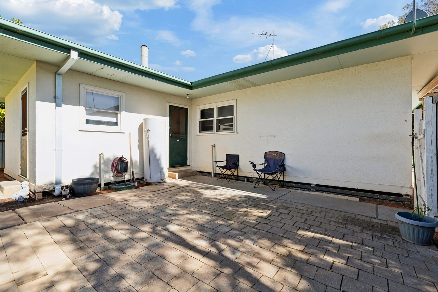 Paved patio at the rear of the home